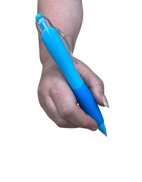 Large grip pen being held in a right hand