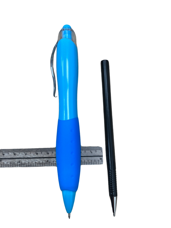 Large grip pen next to conventional sized pen with a ruler demonstrating the width