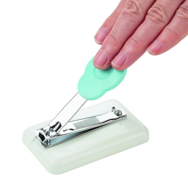 Table top nail clipper being used